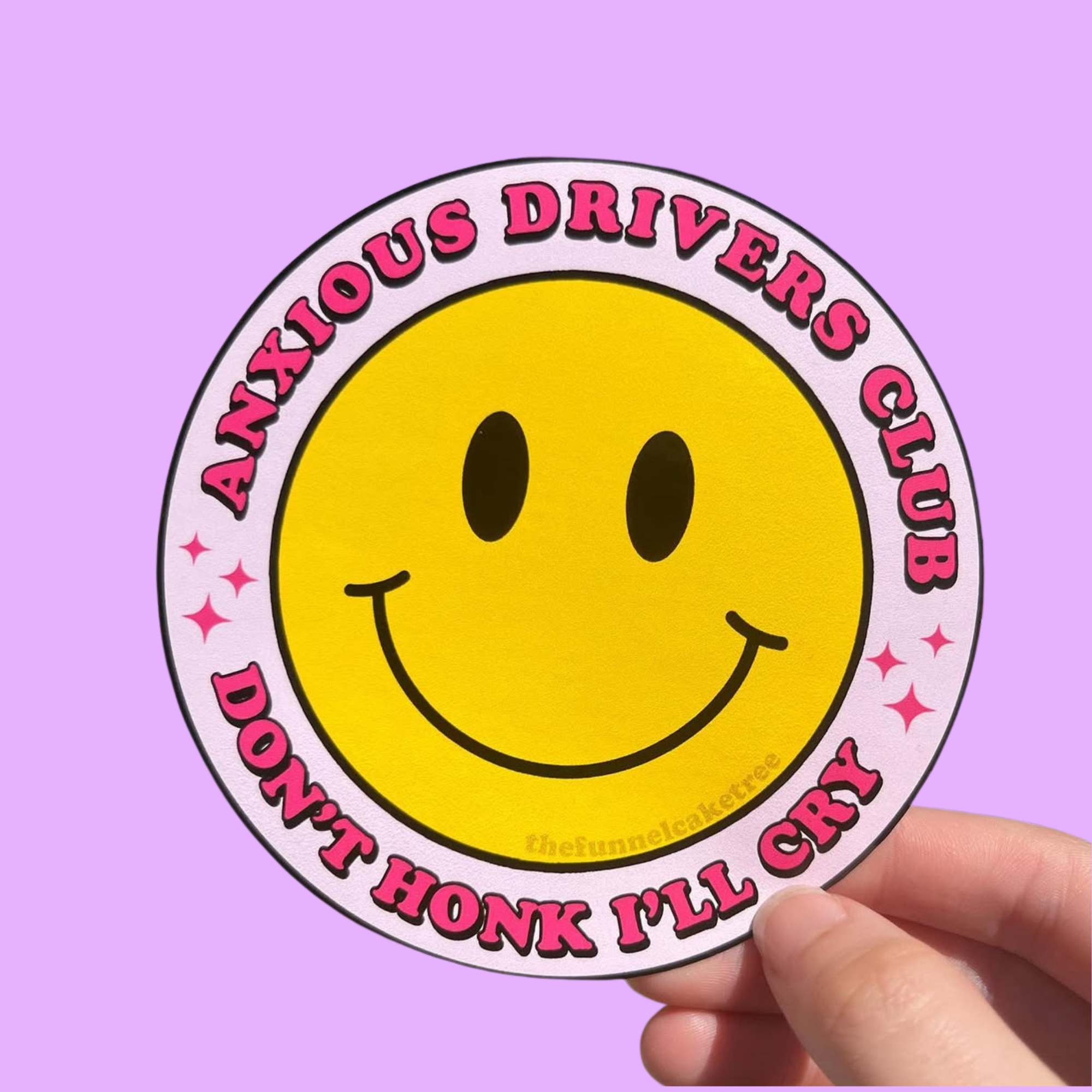“Funny vinyl bumper sticker that says ‘Anxious Drivers Club, Don't Honk I'll Cry’ — waterproof and UV-protected, perfect for cars.”
