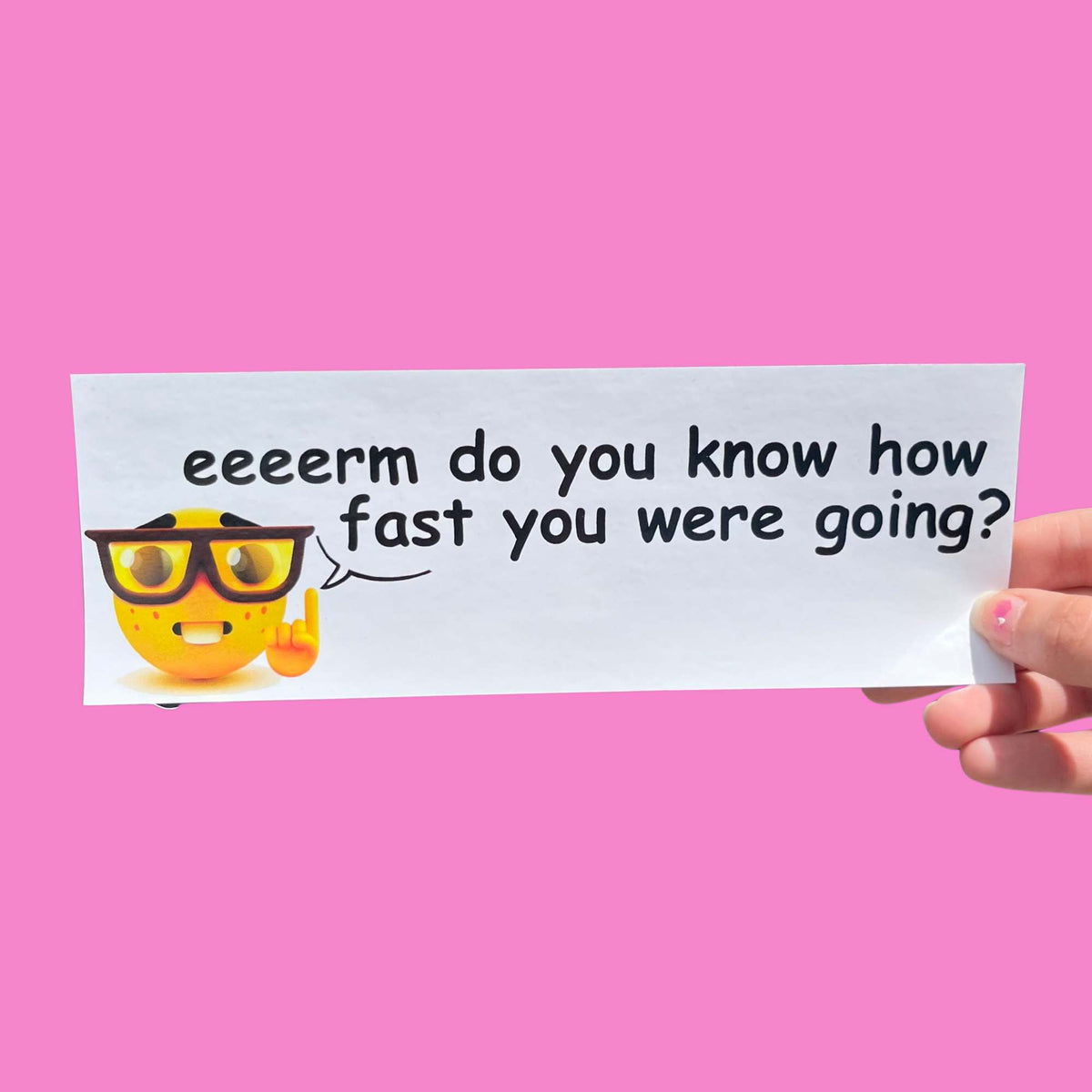 Glossy white bumper sticker with smiling emoji wearing glasses