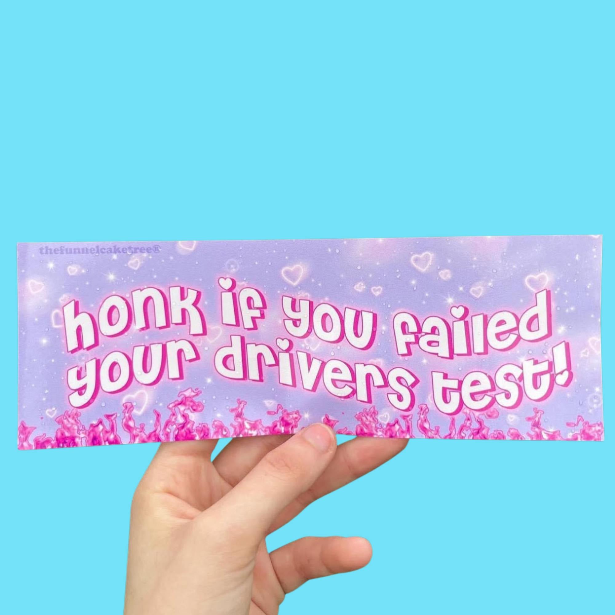  “Funny vinyl bumper sticker that says ‘Honk if you failed your drivers test’ — waterproof and UV-protected, perfect for cars.”