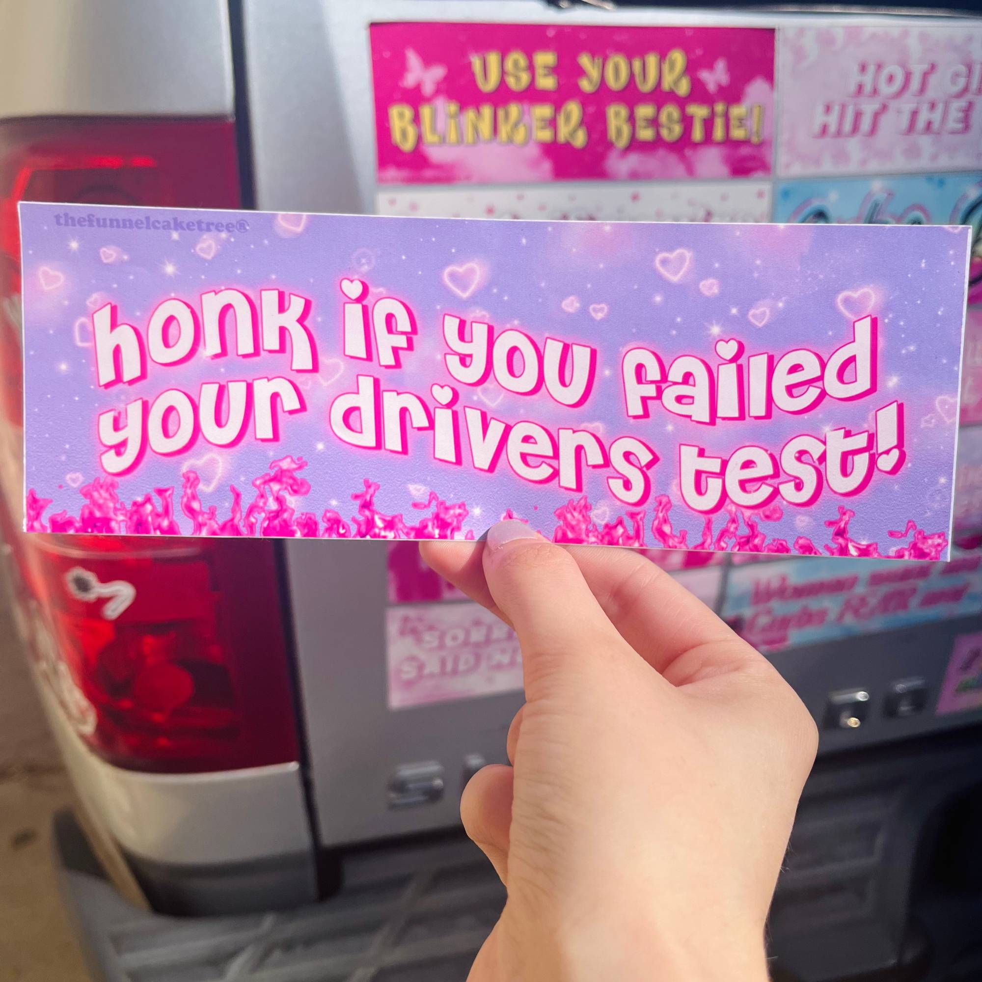  “Funny vinyl bumper sticker that says ‘Honk if you failed your drivers test’ — waterproof and UV-protected, perfect for cars.”