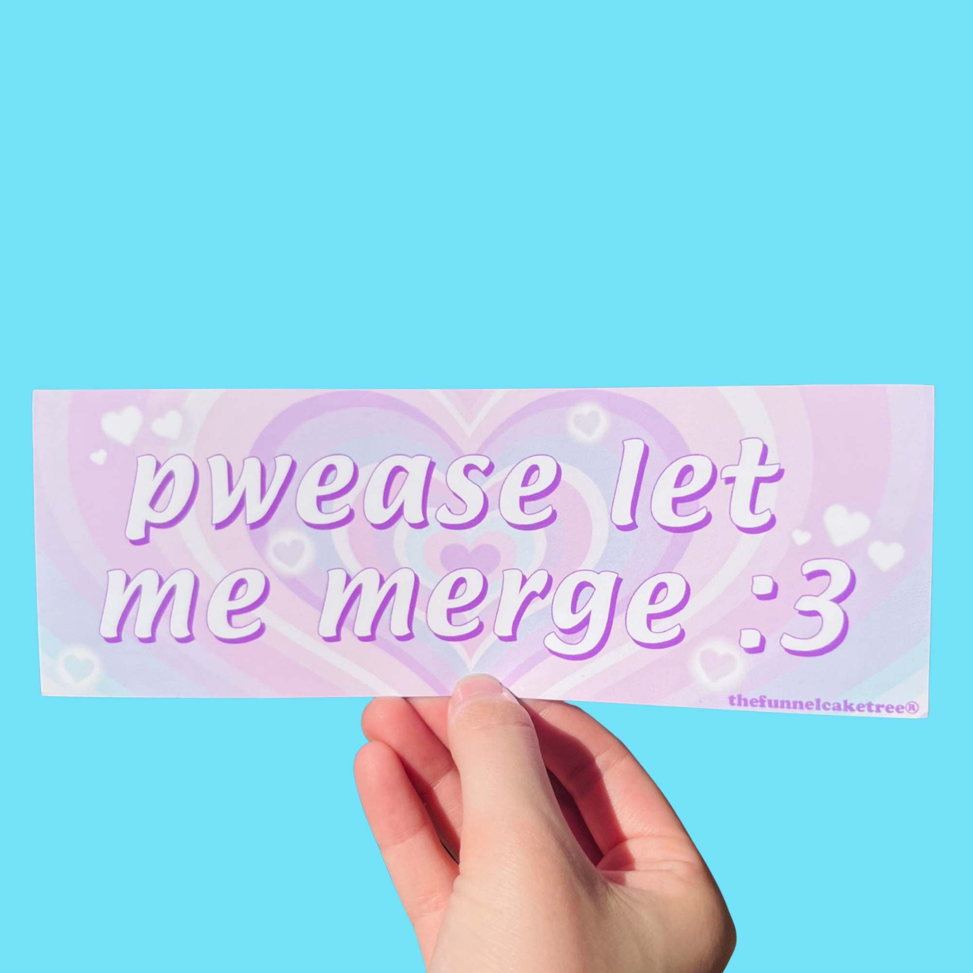 Glossy pastel purple and pink bumper sticker with heart background and text reading “pwease let me merge :3,” held against a blue background.