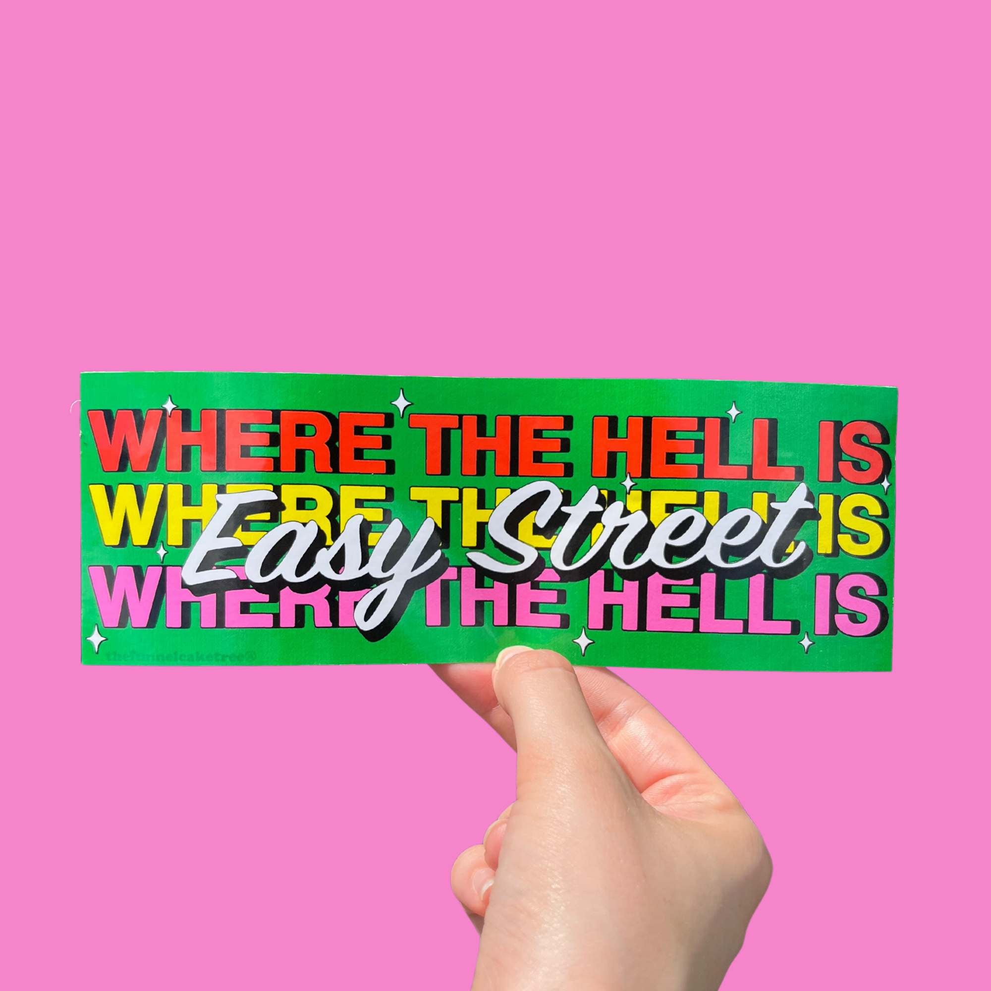 “Funny vinyl bumper sticker that says ‘Where the hell is easy street’ — waterproof and UV-protected, perfect for cars.”

