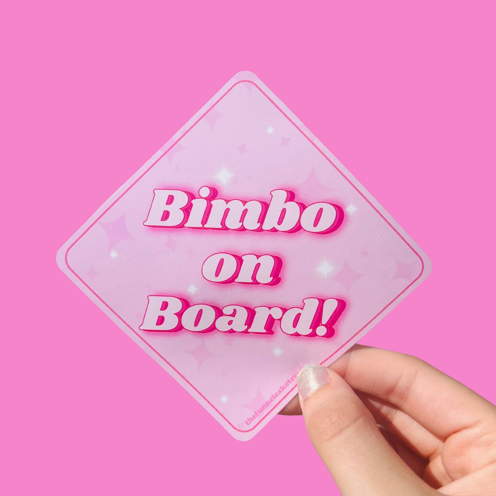  “Funny vinyl bumper sticker that says ‘Bimbo on Board’ — waterproof and UV-protected, perfect for cars.”
