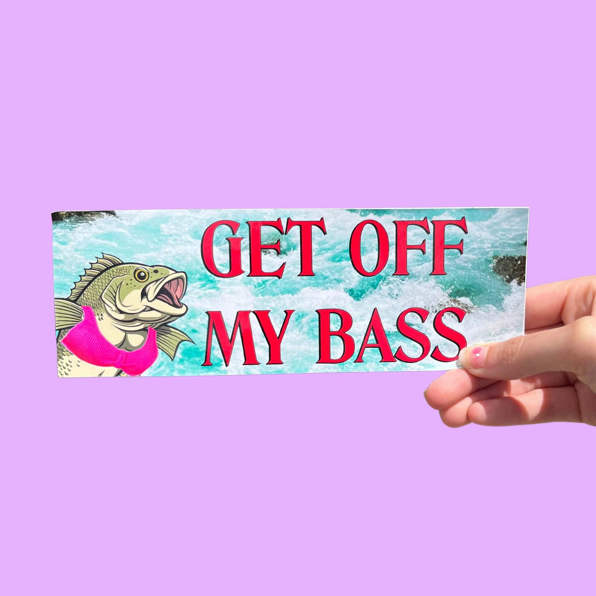 Glossy bumper sticker with turquoise water background, red text reading “GET OFF MY BASS,” and an illustrated bass wearing a pink bikini.
