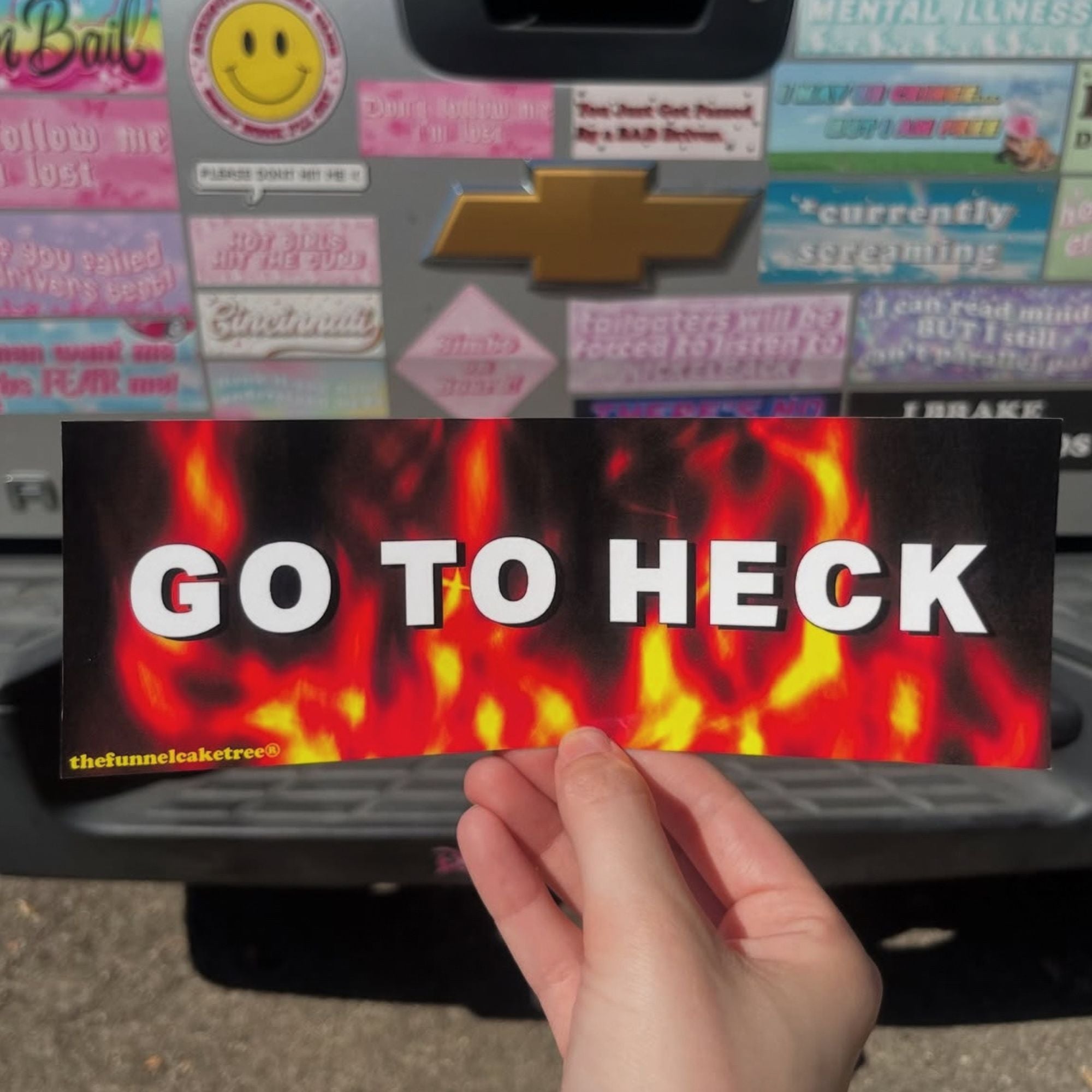 “Funny vinyl bumper sticker that says ‘Go To Heck’ — waterproof and UV-protected, perfect for cars.”
