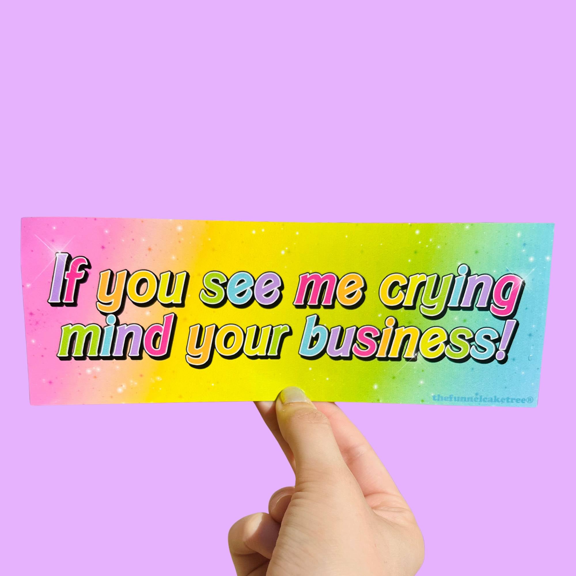  “Funny vinyl bumper sticker that says ‘If you see me crying mind your business’ — waterproof and UV-protected, perfect for cars.”
