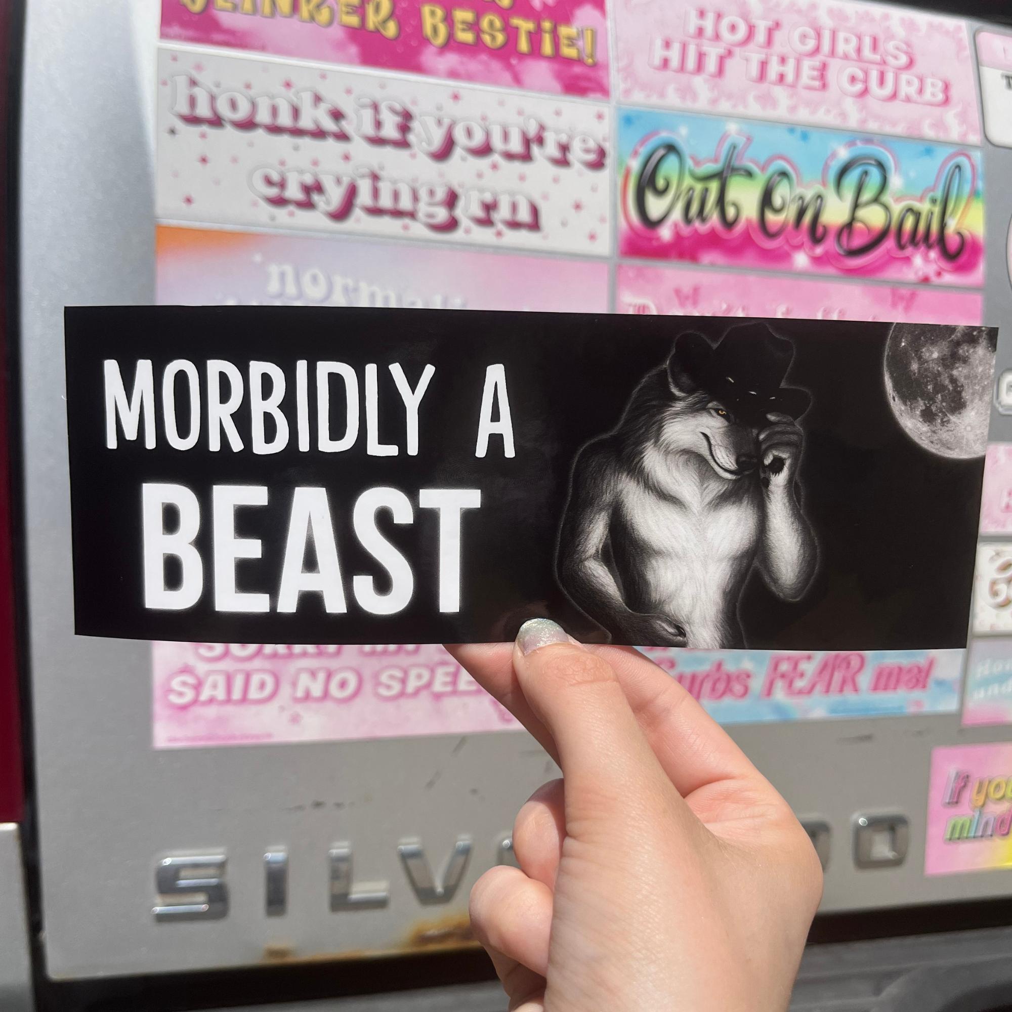 “Funny vinyl bumper sticker that says ‘Morbidly a Beast’ — waterproof and UV-protected, perfect for cars.”