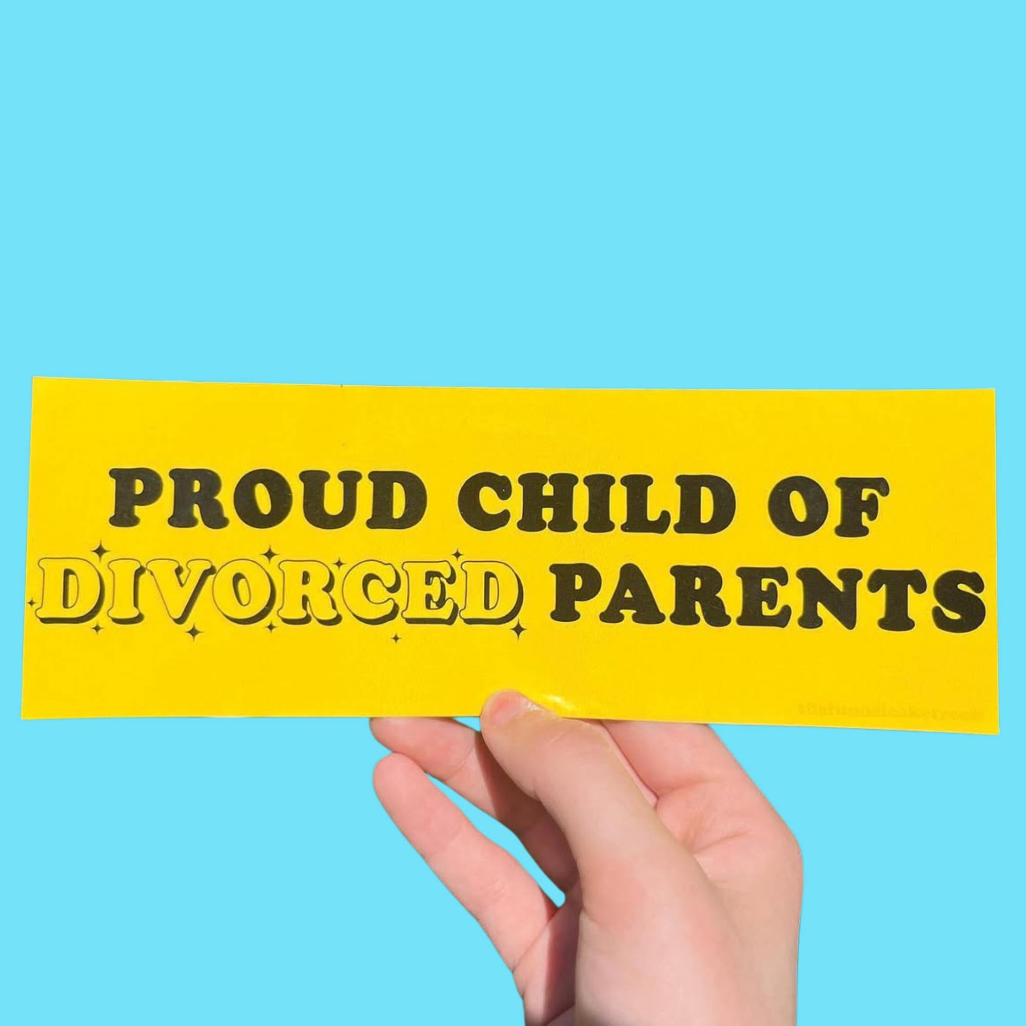  Funny vinyl bumper sticker that is yellow and says ‘Proud child of divorced parents’ in black text — waterproof and UV-protected, perfect for cars.