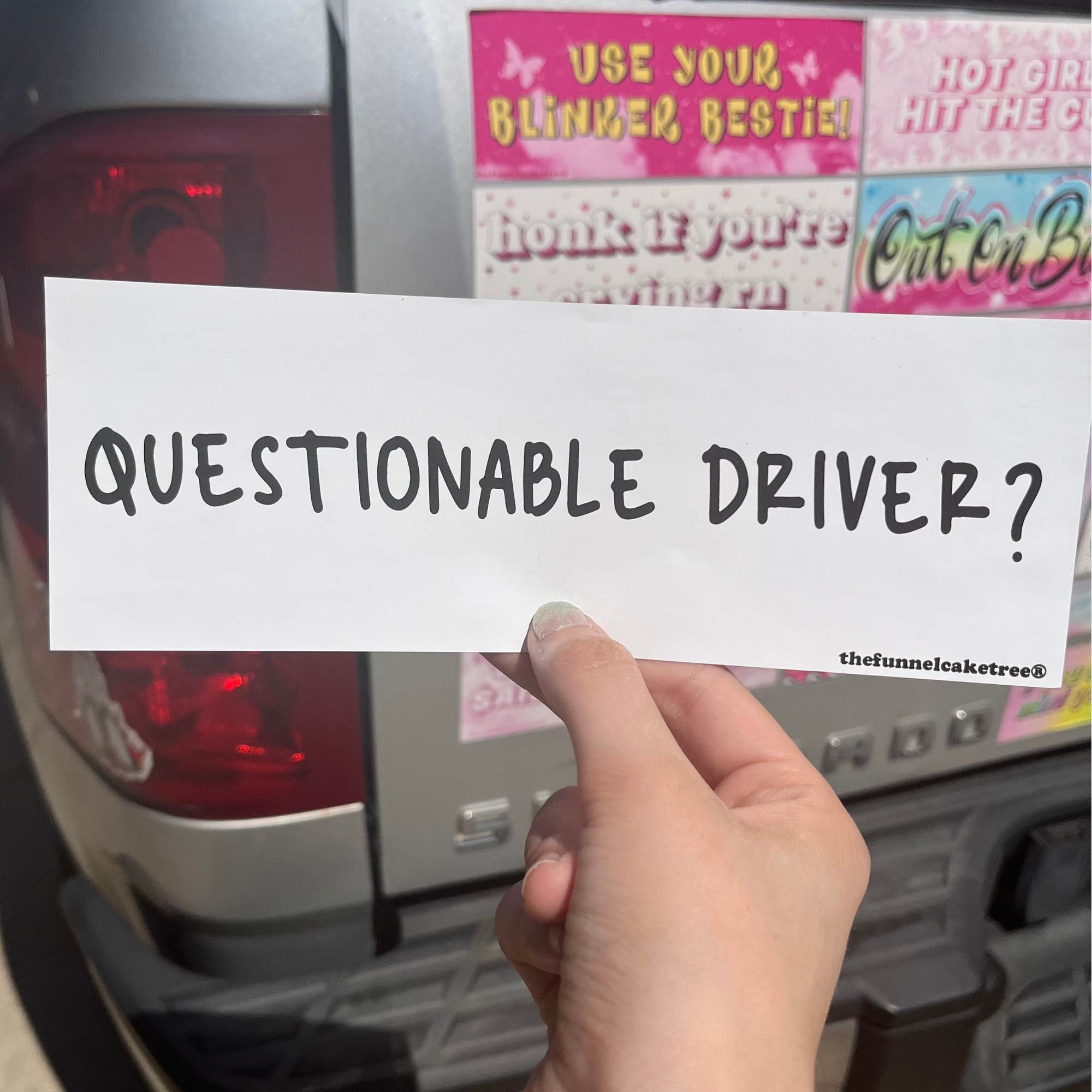  “Funny vinyl bumper sticker that says ‘Questionable Driver?’ — waterproof and UV-protected, perfect for cars.”