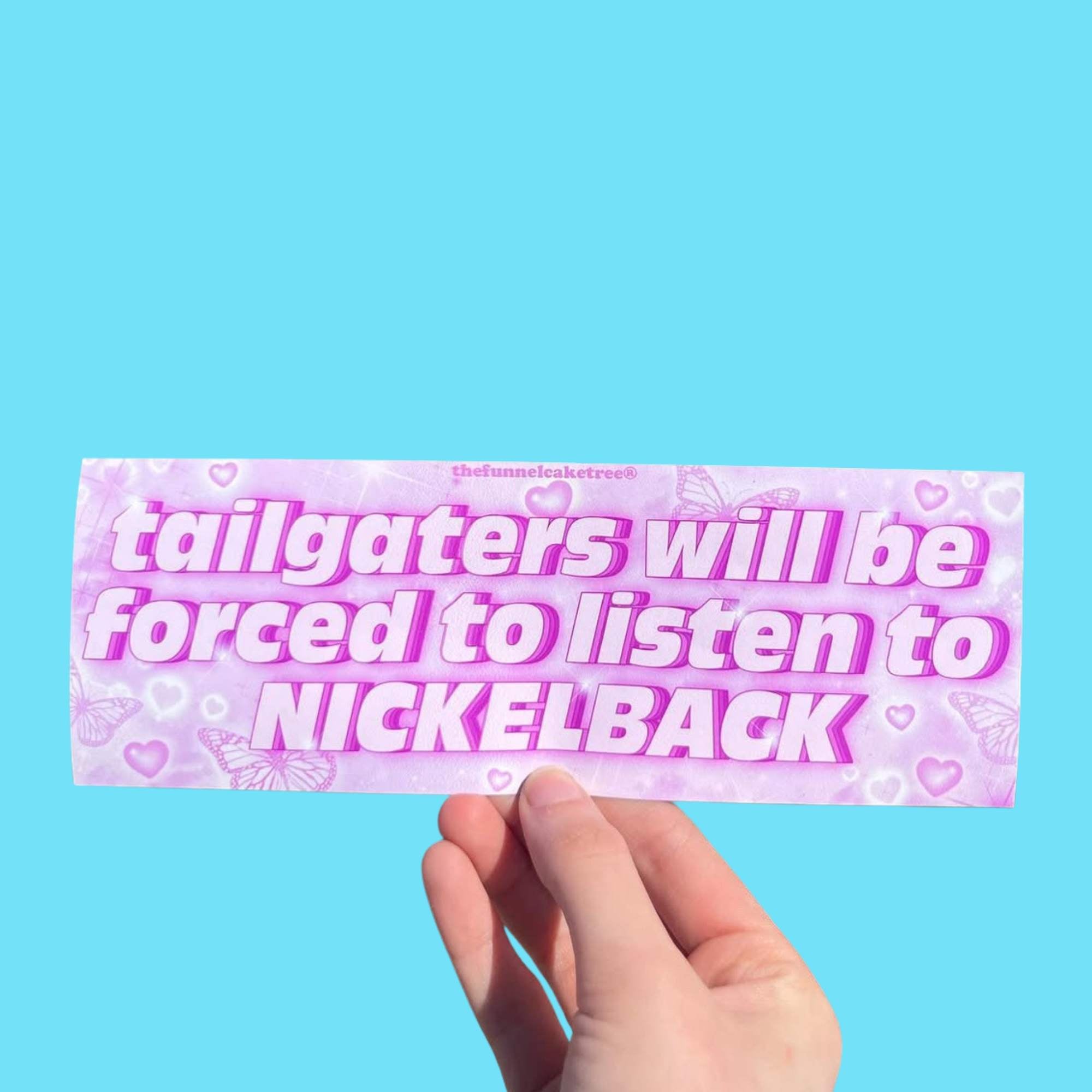 Glossy pastel pink and purple bumper sticker with butterfly and heart accents and bold text reading “Tailgaters will be forced to listen to Nickelback.”