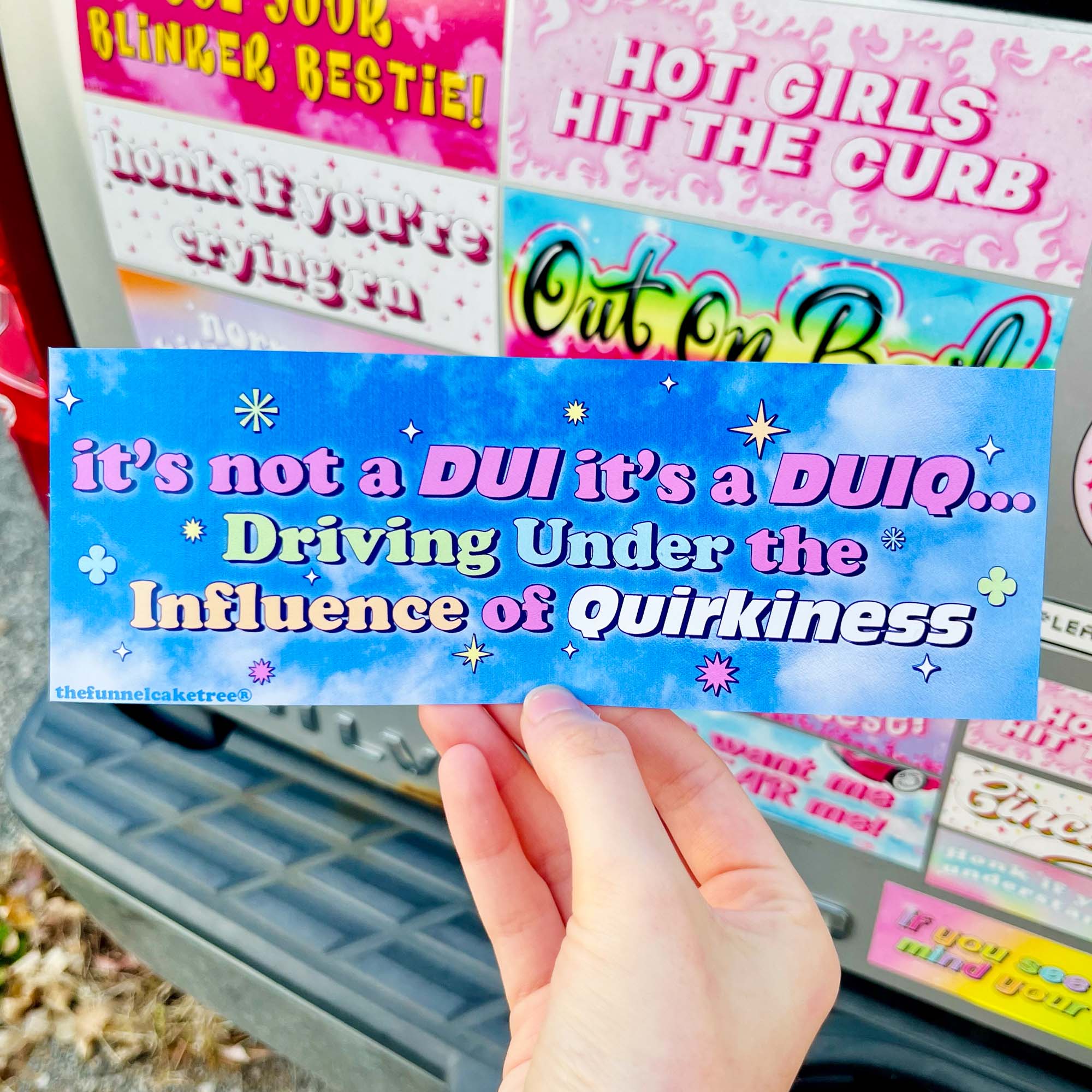  “Funny vinyl bumper sticker that says ‘Driving Under the Influence of Quirkiness’ — waterproof and UV-protected, perfect for cars.”
