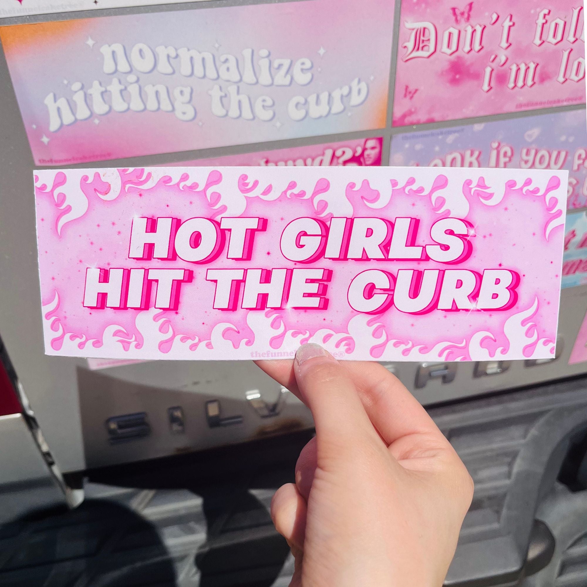  “Funny vinyl bumper sticker that says ‘Hot Girls Hit The Curb’ — waterproof and UV-protected, perfect for cars.”
