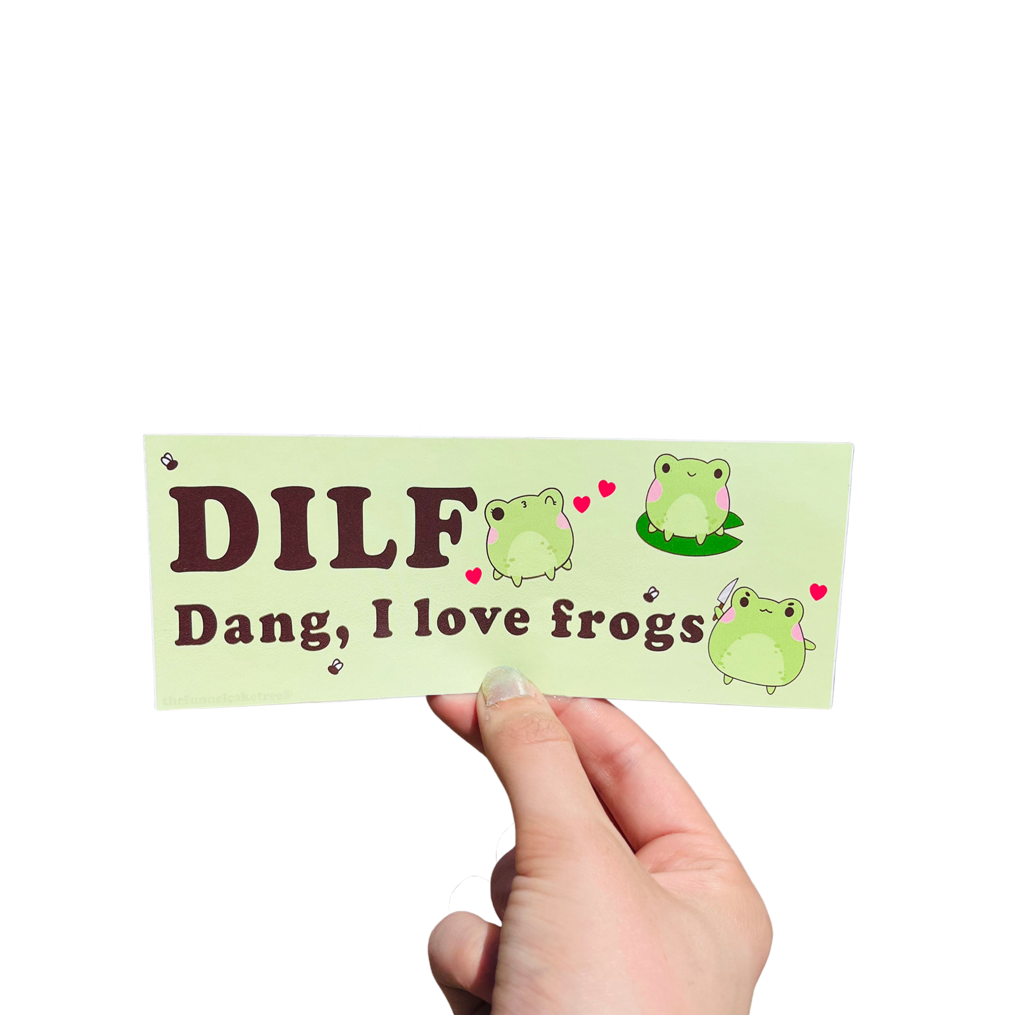 Hand holding a green mini bumper sticker reading 'DILF — Dang, I love frogs,' with cartoon frogs and hearts.