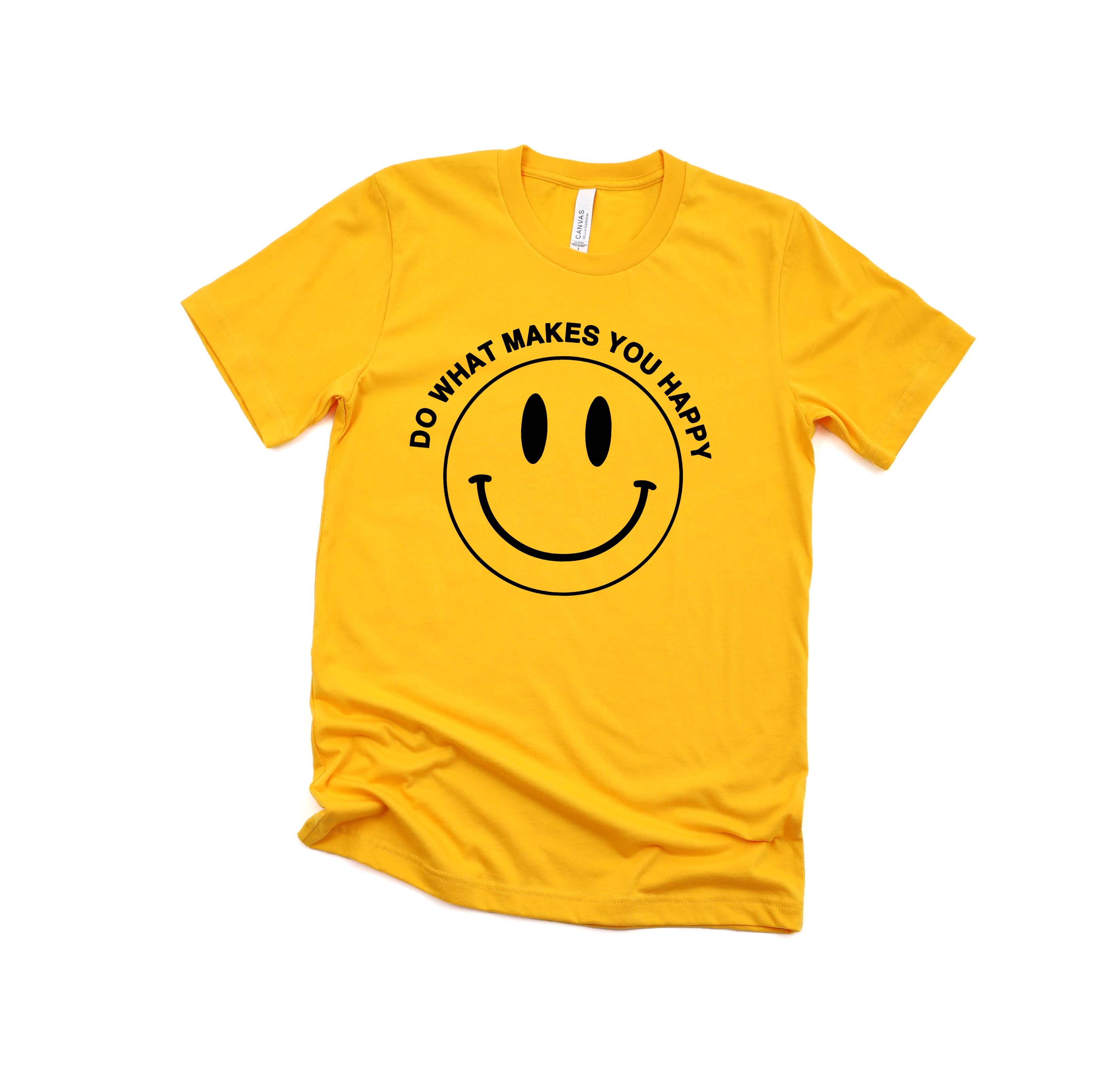 Yellow ‘Do What Makes You Happy’ t-shirt by Funnel Cake Tree featuring a black smiley face design - fun retro positive graphic tee.