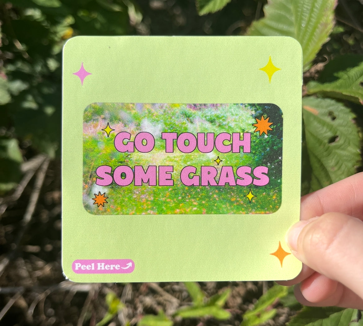 “Funny vinyl sticker that says ‘go touch some grass’ — waterproof and UV-protected, perfect for cars, water bottles, notebooks, laptops, skateboards, etc