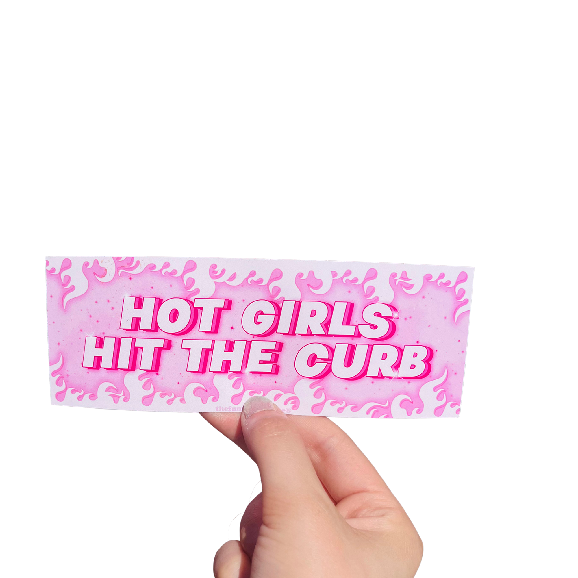 Hand holding a pink flame-patterned mini bumper sticker reading 'HOT GIRLS HIT THE CURB.'