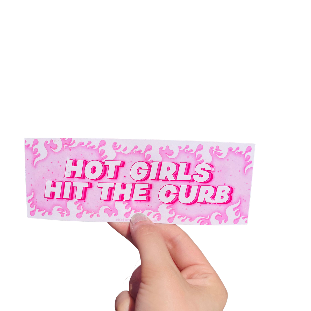 Hand holding a pink flame-patterned mini bumper sticker reading 'HOT GIRLS HIT THE CURB.'