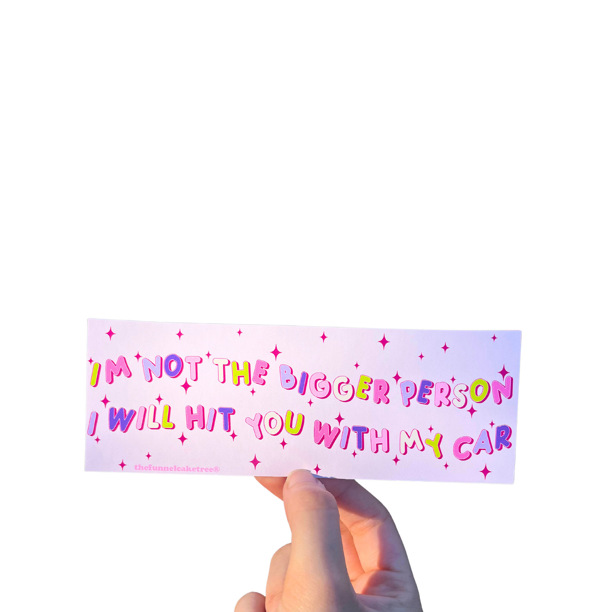 Hand holding a pink mini bumper sticker reading 'I'm not the bigger person. I will hit you with my car.'