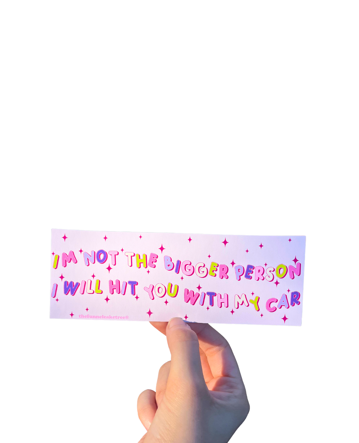 Hand holding a pink mini bumper sticker reading 'I'm not the bigger person. I will hit you with my car.'