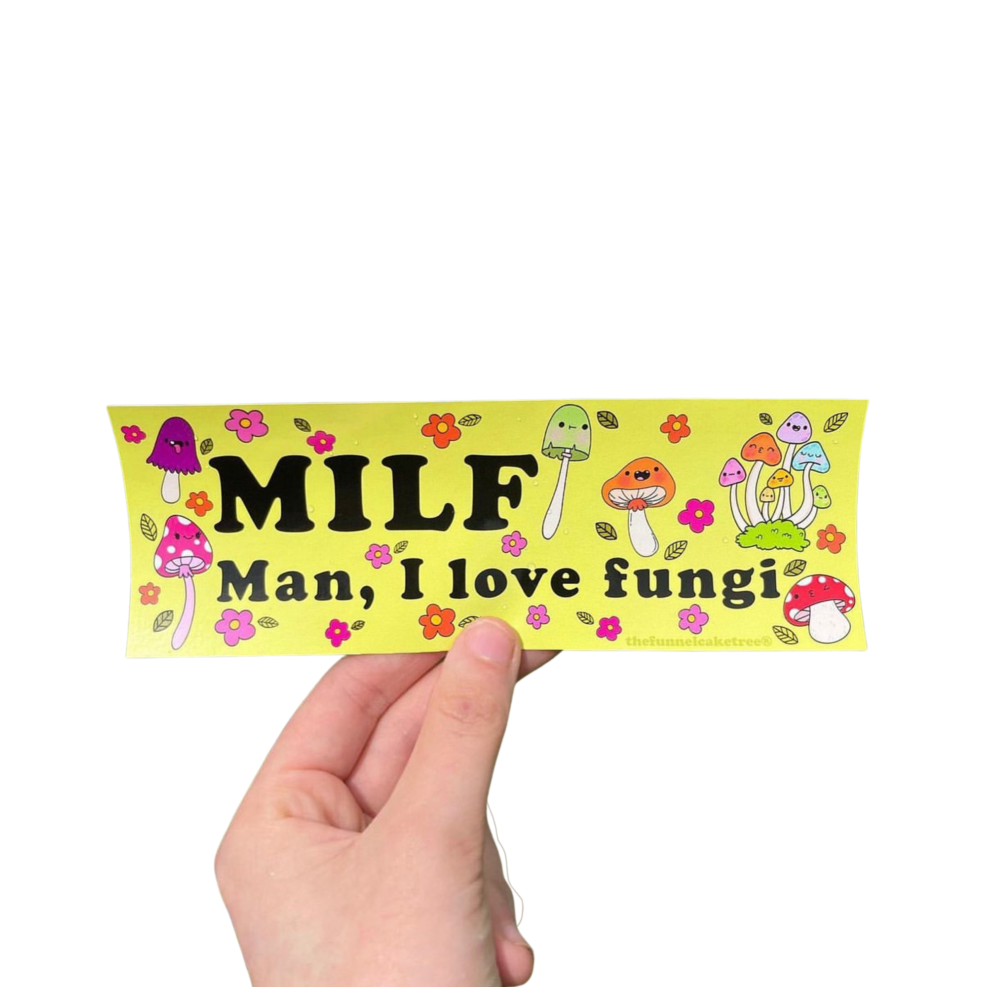 Hand holding a yellow-green 'MILF — Man, I love fungi' mini bumper sticker with colorful mushrooms and flowers.
