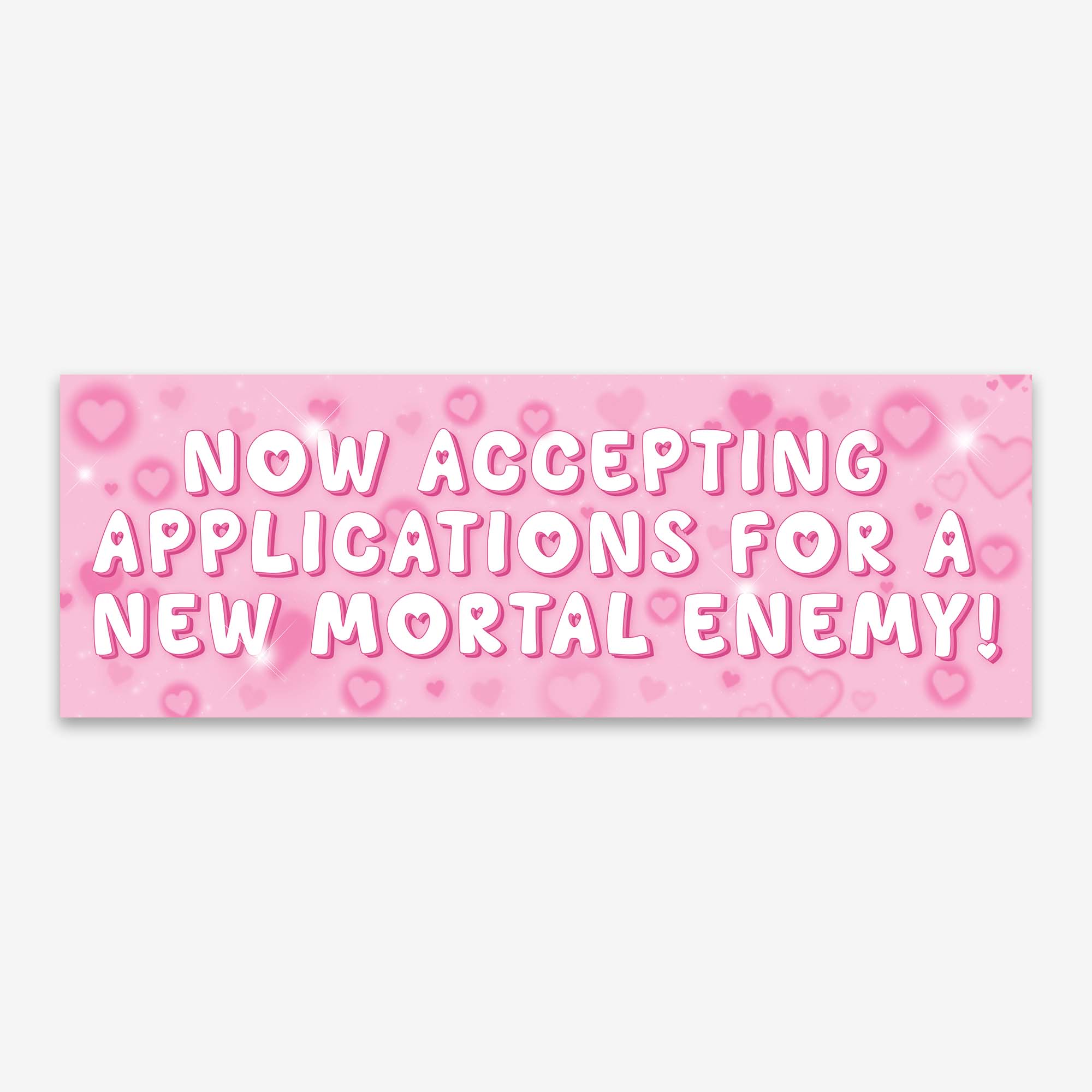 Glossy pink bumper sticker with white bold text reading “NOW ACCEPTING APPLICATIONS FOR A NEW MORTAL ENEMY!” surrounded by pink hearts and sparkles.