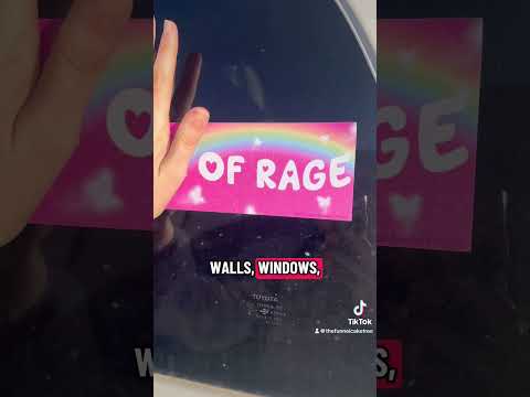 Video of a person adding and removing ReStickables removable stickers to cars 