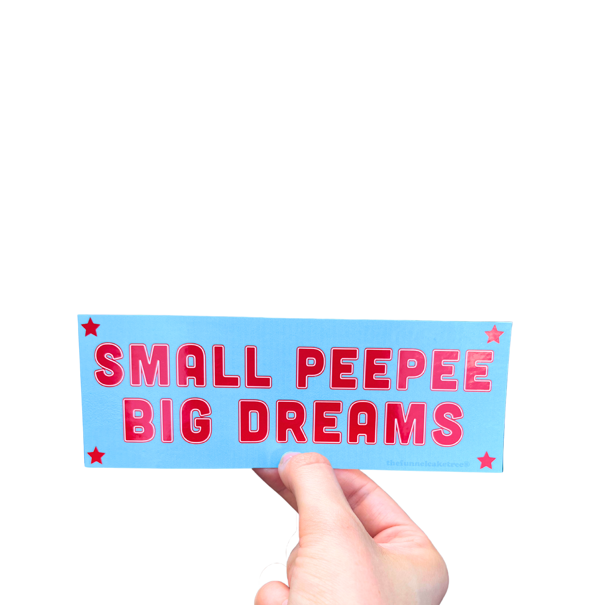 Hand holding a blue mini bumper sticker reading 'SMALL PEEPEE BIG DREAMS' in red letters with stars.