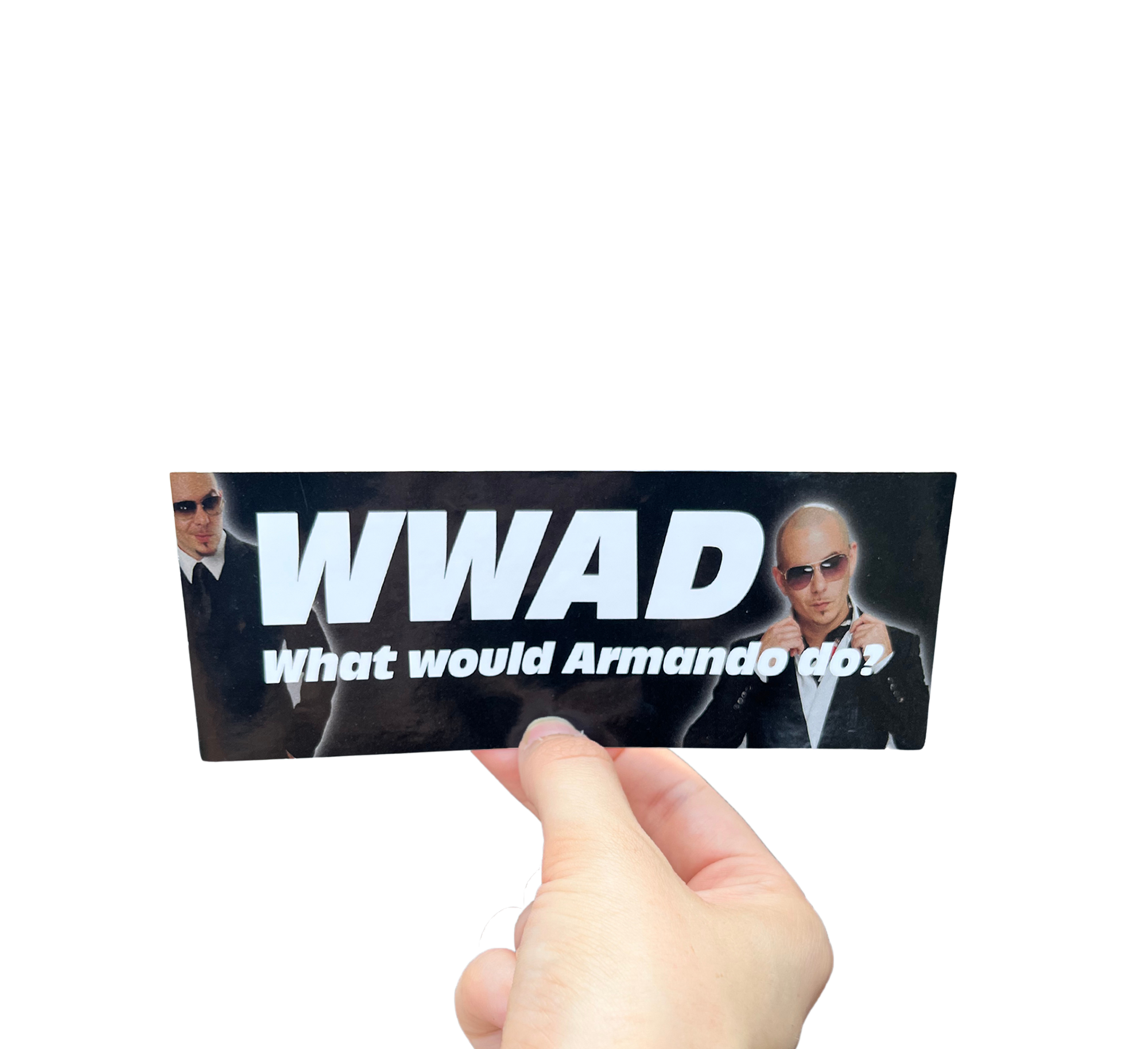 Hand holding a black mini bumper sticker reading 'WWAD — What would Armando do?' with portraits of a man in sunglasses.