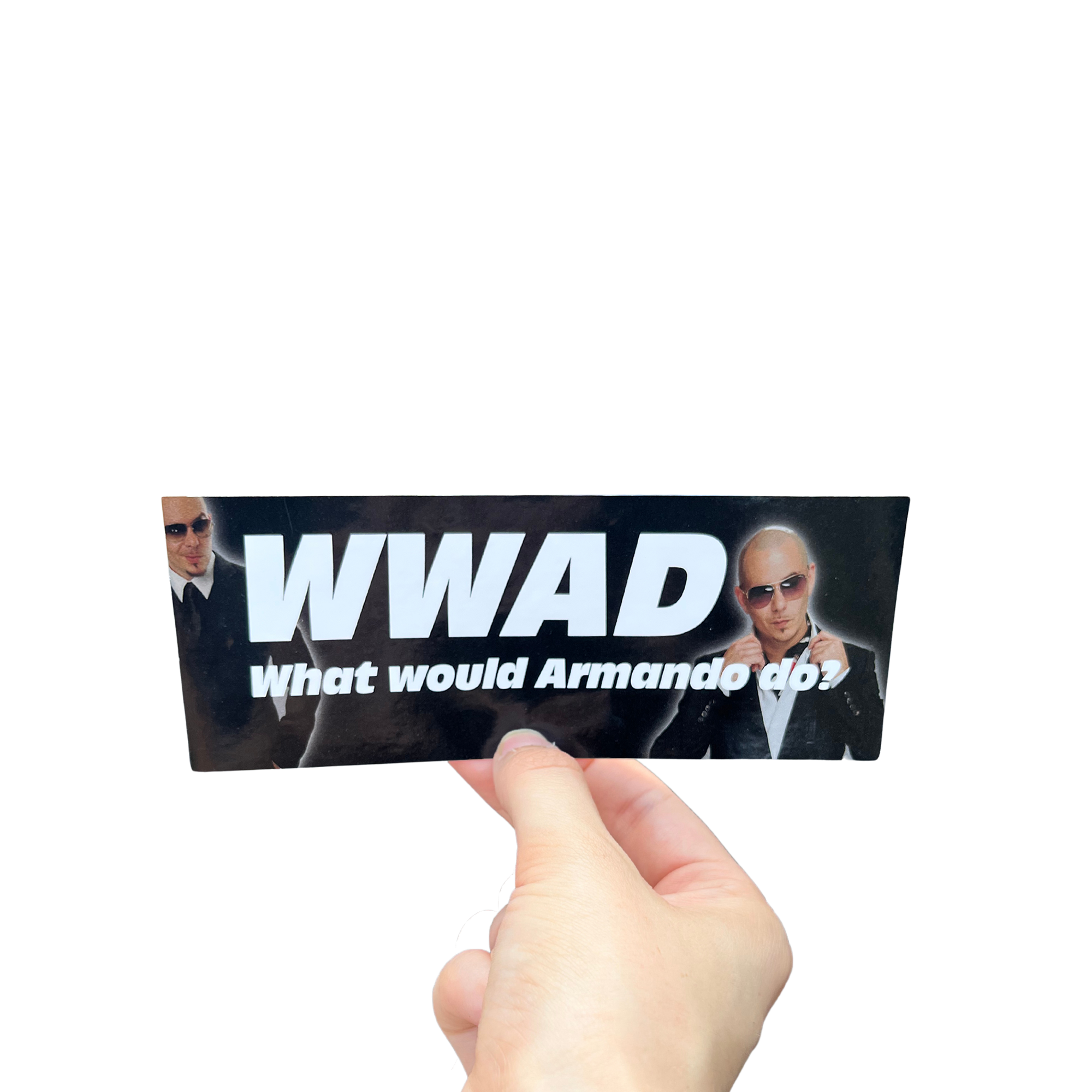 Hand holding a black mini bumper sticker reading 'WWAD — What would Armando do?' with portraits of a man in sunglasses.