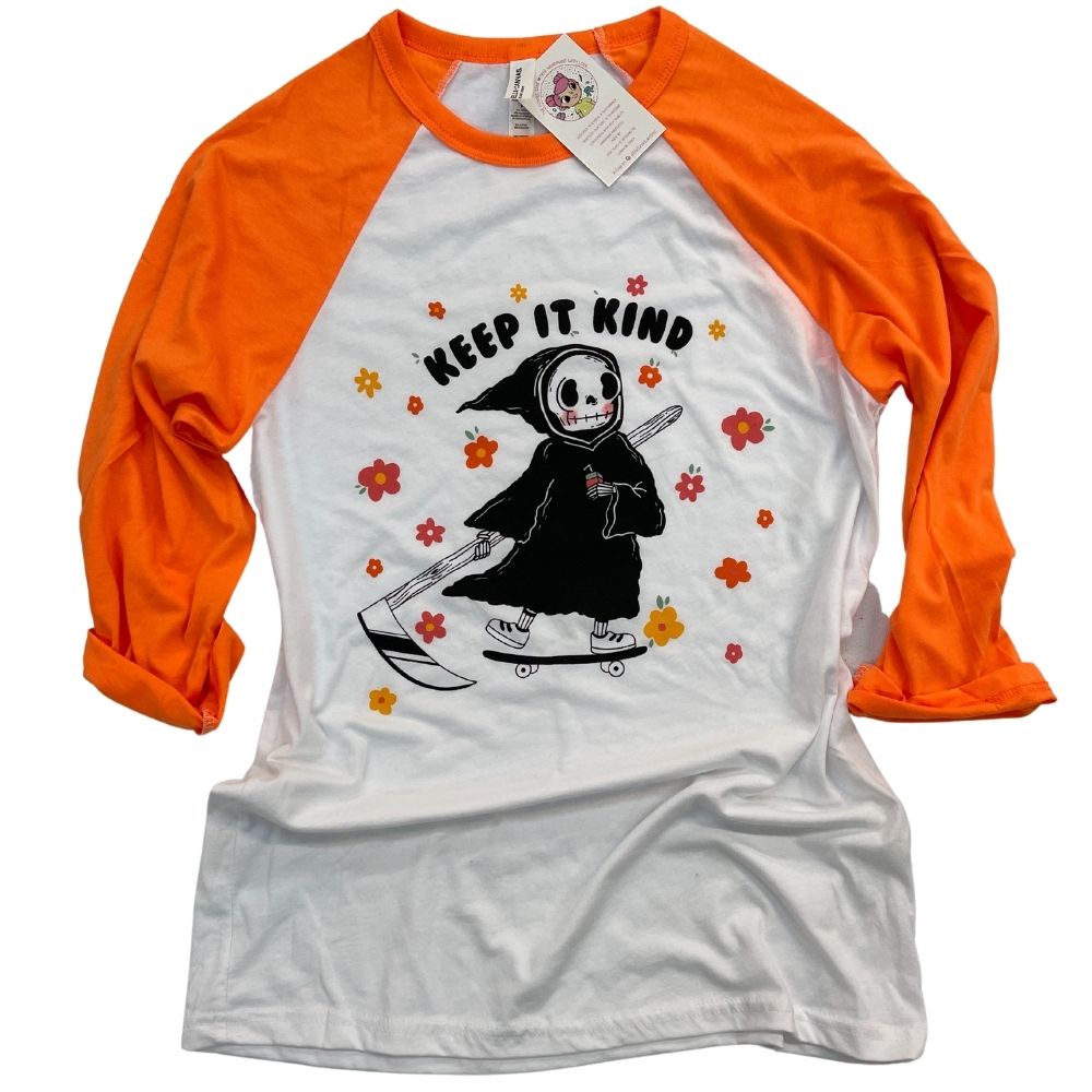 orange and white raglan tshirt with original art work by izzy with the funnel cake tree printed on the front