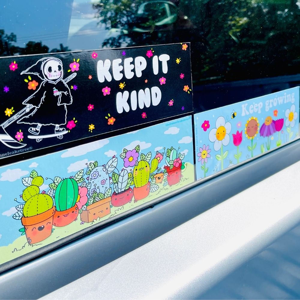 Three rectangular stickers on a car window, including a Prickly Pals sticker with colorful cartoon cacti in red pots.