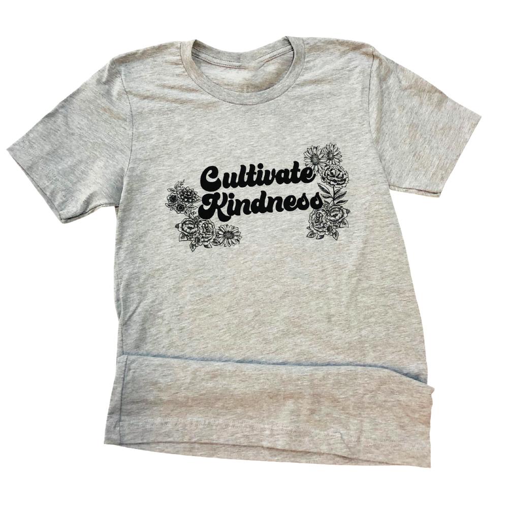 Funnel Cake Tree grey ‘Cultivate Kindness’ floral graphic tee laid flat, featuring black flower illustrations around bold script text.